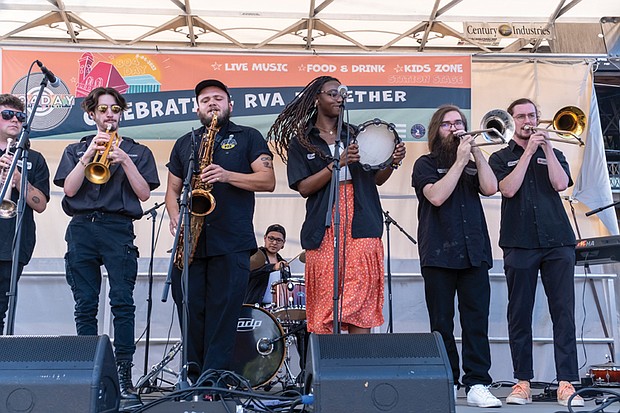 The Latin and funk band Los Malcriados performs at the inaugural 804 Day event at the 17th Street Farmers’ Market in Shockoe Bottom on Aug. 4.