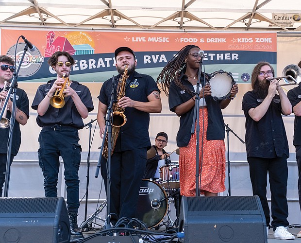 The Latin and funk band Los Malcriados performs at the inaugural 804 Day event at the 17th Street Farmers’ Market in Shockoe Bottom on Aug. 4.