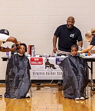 Virginia Barber School graduate DeAndre Delaware, left, and current student Brooke Viele gave free back-to-school haircuts to participants at the We Care Community Festival on Saturday at Hotchkiss Field in Richmond’s North Side. The Annual We Care Festival celebrates all that is good in Richmond by promoting wellness, education, community awareness and resident empowerment.