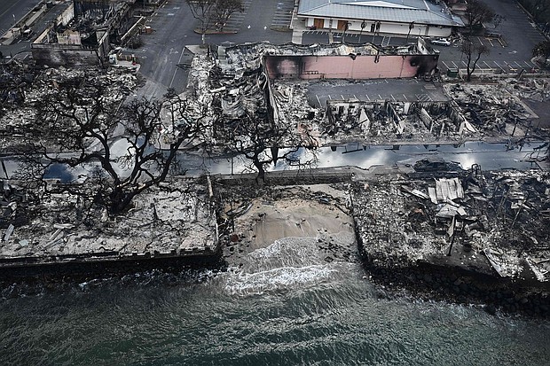 An aerial image taken on August 10, 2023 shows destroyed homes and buildings on the waterfront burned to the ground in Lahaina in the aftermath of wildfires in western Maui, Hawaii.
Mandatory Credit:	Patrick T. Fallon/AFP/Getty Images
