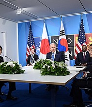 US President Joe Biden, flanked by US Secretary of Defense Lloyd Austin and Secretary of State Antony Blinken, sits with South Korea's President Yoon Suk-Yeol (L) and Japan's Prime Minister Fumio Kishida (R) during a trilateral meeting on the sidelines of the NATO summit in Madrid, on June 29, 2022.
Mandatory Credit:	Brendan SmialowskiAFP/Getty Images