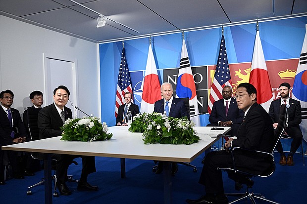US President Joe Biden, flanked by US Secretary of Defense Lloyd Austin and Secretary of State Antony Blinken, sits with South Korea's President Yoon Suk-Yeol (L) and Japan's Prime Minister Fumio Kishida (R) during a trilateral meeting on the sidelines of the NATO summit in Madrid, on June 29, 2022.
Mandatory Credit:	Brendan SmialowskiAFP/Getty Images