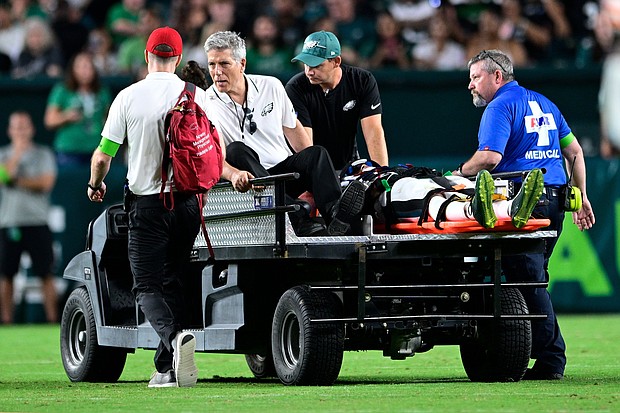 Philadelphia Eagles wide receiver Tyrie Cleveland is brought off the field after an injury during the second half of the NFL preseason football game.
Mandatory Credit:	Derik Hamilton/AP