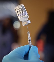 The immune response may be stronger if a Covid-19 booster goes in the same arm as your last shot, a new study suggests.
Mandatory Credit:	Scott Olson/Getty Images