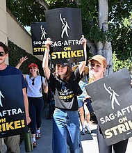 Matt Dallas, Chloe Fineman and Joey King join SAG-AFTRA and WGA Members and Supporters as they walk the picket line in support of the SAG-AFTRA and WGA strike on Day 2 at the Warner Bros. Studio on July 14, in Burbank, California.
Mandatory Credit:	Michael Buckner/Variety/Getty Images