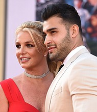 Britney Spears (left) and Sam Asghari arrive at the Los Angeles premiere of "Once Upon a Time in Hollywood," at the TCL Chinese Theatre, on July 22, 2019.
Mandatory Credit:	Jordan Strauss/Invision/AP