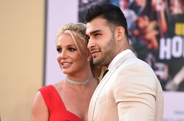 Britney Spears (left) and Sam Asghari arrive at the Los Angeles premiere of "Once Upon a Time in Hollywood," at the TCL Chinese Theatre, on July 22, 2019.
Mandatory Credit:	Jordan Strauss/Invision/AP