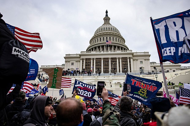 Pro-Trump supporters storm the U.S. Capitol following a rally with President Donald Trump on January 6, 2021 in Washington, DC.
Mandatory Credit:	Samuel Corum/Getty Images/FILE