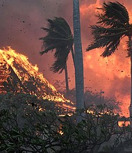 The hall of historic Waiola Church in Lahaina and nearby Lahaina Hongwanji Mission are engulfed in flames along Wainee Street on August 8, in Lahaina, Hawaii.
Mandatory Credit:	Matthew Thayer/The Maui News/AP