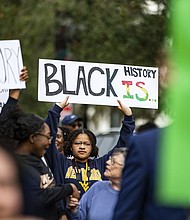 Demonstrators gather in February in Tallahassee, Florida, during a protest over Gov. Ron DeSantis' rejection of a high school African American history course that included lessons about reparations.
Mandatory Credit:	Alicia Devine/Tallahassee Democrat/AP