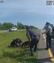 This image taken from police body cam video shows a police dog attacking Jadarrius Rose on July 4 in Circleville, Ohio.
Mandatory Credit:	Ohio State Highway Patrol via AP