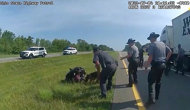 This image taken from police body cam video shows a police dog attacking Jadarrius Rose on July 4 in Circleville, Ohio.
Mandatory Credit:	Ohio State Highway Patrol via AP