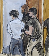 In this sketch, in Federal Court in New York, August 11, FTX founder Sam Bankman-Fried is escorted by court officers from the courtroom.
Mandatory Credit:	Elizaberth Williams/AP