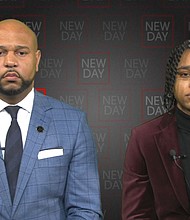 Carlos Moore, left, and his client D'monterrio Gibson
Mandatory Credit:	CNN