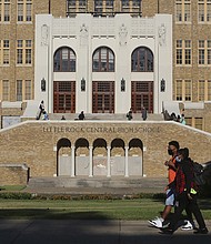 Students make their way into Little Rock Central High School in 2020.
Mandatory Credit:	Tommy Metthe/AP