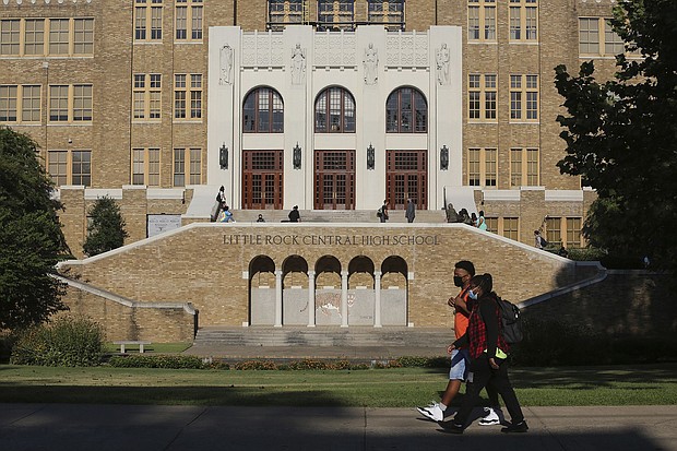 Students make their way into Little Rock Central High School in 2020.
Mandatory Credit:	Tommy Metthe/AP