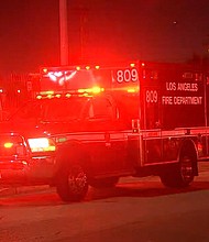 An emergency vehicle sits outside White Memorial Hospital.