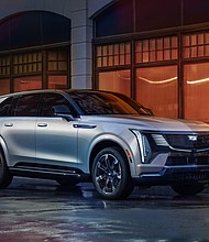 Cadillac ESCALADE IQ Sport in Flare Metallic with shield-shaped grille in view.