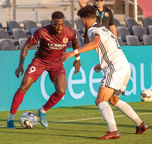 Kharlton Belmar is the Richmond Kickers’ traveling man. Both his suitcase and soccer cleats are high mileage.