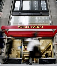 People walk past a Wells Fargo branch on January 10, 2023 in New York City.
Mandatory Credit:	Leonardo Munoz/Corbis/Getty Images