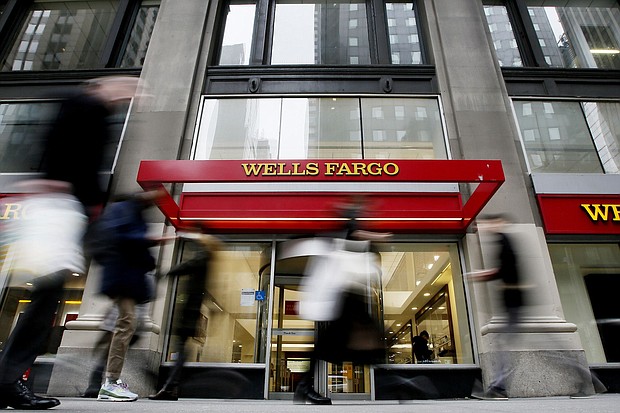 People walk past a Wells Fargo branch on January 10, 2023 in New York City.
Mandatory Credit:	Leonardo Munoz/Corbis/Getty Images