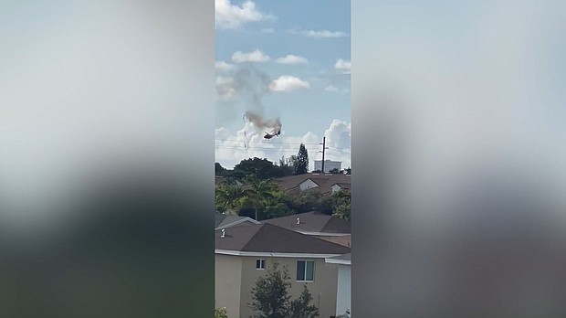 A helicopter goes down in Pompano Beach, Florida, on Monday, August 28.
Mandatory Credit:	Courtesy Buck Daily