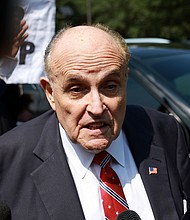 Rudy Giuliani speaks to the media after leaving the Fulton County jail on August 23 in Atlanta.
Mandatory Credit:	Joe Raedle/Getty Images