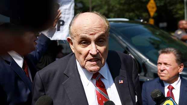 Rudy Giuliani speaks to the media after leaving the Fulton County jail on August 23 in Atlanta.
Mandatory Credit:	Joe Raedle/Getty Images