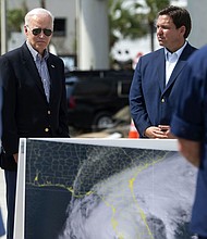 In this October 2022 photo, DeSantis and President Joe Biden meet with residents and emergency workers in Fort Myers Beach, Florida, as they inspect the damage caused by Hurricane Ian.
Mandatory Credit:	Saul Young/Knoxville News Sentinel/Pool/USA Today Network