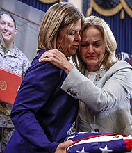 Families of troops killed in Abbey Gate bombing in Afghanistan demand accountability in emotional testimony, and pictured, US Representative Madeleine Dean hugs Christy Shamblin, mother-in-law of Marine Corps Sergeant Nicole L. Gee who was killed in Afghanistan.
Mandatory Credit:	Evelyn Hockstein/Reuters