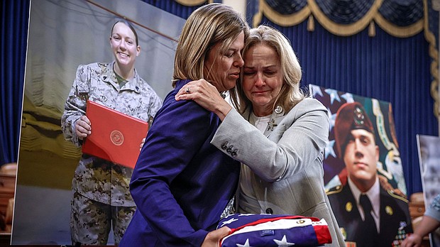 Families of troops killed in Abbey Gate bombing in Afghanistan demand accountability in emotional testimony, and pictured, US Representative Madeleine Dean hugs Christy Shamblin, mother-in-law of Marine Corps Sergeant Nicole L. Gee who was killed in Afghanistan.
Mandatory Credit:	Evelyn Hockstein/Reuters