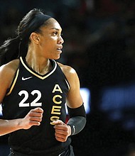 Las Vegas Aces forward A’ja Wilson (22) heads up court after scoring against the New York Liberty during the first half of a WNBA basketball game Aug. 15 in Las Vegas.