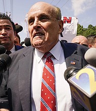 Rudy Giuliani speaks outside the Fulton County jail last week in Atlanta. Mr. Giuliani has surrendered to authorities in Georgia to face an indictment alleging he acted as former President Trump’s chief co-conspirator in a plot to subvert the 2020 election.
