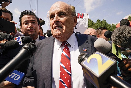 Rudy Giuliani speaks outside the Fulton County jail last week in Atlanta. Mr. Giuliani has surrendered to authorities in Georgia to face an indictment alleging he acted as former President Trump’s chief co-conspirator in a plot to subvert the 2020 election.