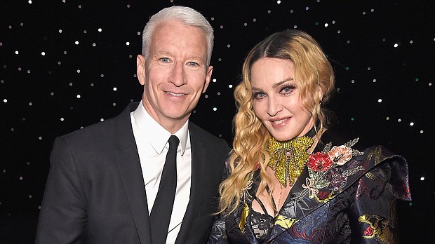 Anderson Cooper and Madonna pose together at the Billboard Women in Music 2016 event on December 9, 2016 in New York City. Cooper has mixed feelings about the time he briefly shared a stage with Madonna.
Mandatory Credit:	Kevin Mazur/Getty Images
