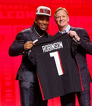 Bijan Robinson poses with NFL Commissioner Roger Goodell after being selected eighth overall by the Atlanta Falcons.
Mandatory Credit:	David Eulitt/Getty Images