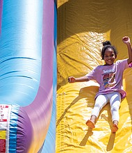 A giant slide found a more than willing slider in 5-year-old Lailani Maragh during the 17th Annual WE CARE Community Festival on Aug. 12 at Hotchkiss Community Center. The annual festival promotes wellness and education.