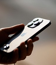 Shares of Apple fell by 3.4% following reports that China plans to expand a ban on the use of iPhones to government-backed agencies and companies.
Mandatory Credit:	Thomas Peter/Reuters