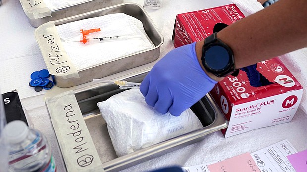 New Covid-19 vaccines are available from Moderna and Pfizer/BioNTech for everyone 6 months and older following approval from the US Centers for Disease Control and Prevention.
Mandatory Credit:	Mark J. Terrill/AP