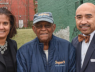 Neverett A.Eggleston Jr.,center,who helped found the Metropolitan Business League in 1968, stands with Carla P. Childs and Gary L. Flowers on the site of the organization’s original home on 2nd Street near Jackson Street in Jackson Ward.