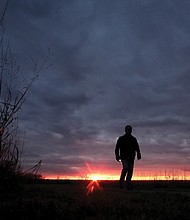In this Nov. 20, 2015, file photo, a man walks along a trail during sunset near Manhattan, Kan. In 2022, about 49,500 people took their own lives in the U.S., the highest number ever, according to data from the Centers for Disease Control and Prevention released on Aug. 10.