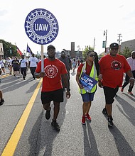 United Auto Workers members march in the Detroit Labor Day Parade on September 4 in Detroit, Michigan.
Mandatory Credit:	Bill Pugliano/Getty Images