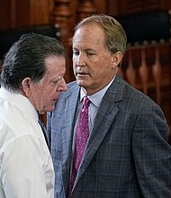 Suspended Texas state Attorney General Ken Paxton, right, talks with his attorney, Dan Cogdell during his impeachment trial in the Senate chamber at the Texas State Capitol in Austin on September 15.
Mandatory Credit:	Eric Gay/AP