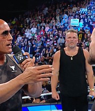 Caption:	Dwayne Johnson makes a WWE appearance on September 15.
Mandatory Credit:	From WWE