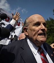 A law firm that represented Rudy Giuliani during recent years of investigations and lawsuits is now suing him for more than $1.3 million in unpaid legal fees. Giuliani is seen here in Atlanta, Georgia, on August 23.
Mandatory Credit:	Christian Monterrosa/AFP/Getty Images