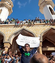 People who survived the deadly floods protest outside the Sahaba Mosque in Derna on September 18.
Mandatory Credit:	Zohra Bensemra/Reuters