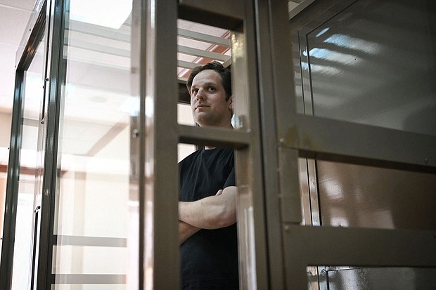 Evan Gershkovich stands inside a defendants' cage before a hearing in Moscow on June 22.
Mandatory Credit:	Natalia Kolesnikova/AFP/Getty Images/File