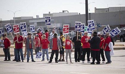 United Auto Workers members strike at the Ford Michigan Assembly Plant on Saturday, Sept. 16, 2023, in Wayne, Michigan. This is the first time in history that the UAW is striking all three of the Big Three auto makers, Ford, General Motors, and Stellantis, at the same time. (Bill Pugliano/Getty Images/TNS)