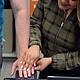 Martiza Seja performs fingerprinting for expungement services client