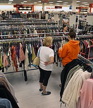 TJ Maxx's offering of discounted branded products is especially appealing to budget-conscious households.
Mandatory Credit:	David L. Ryan/The Boston Globe/Getty Images